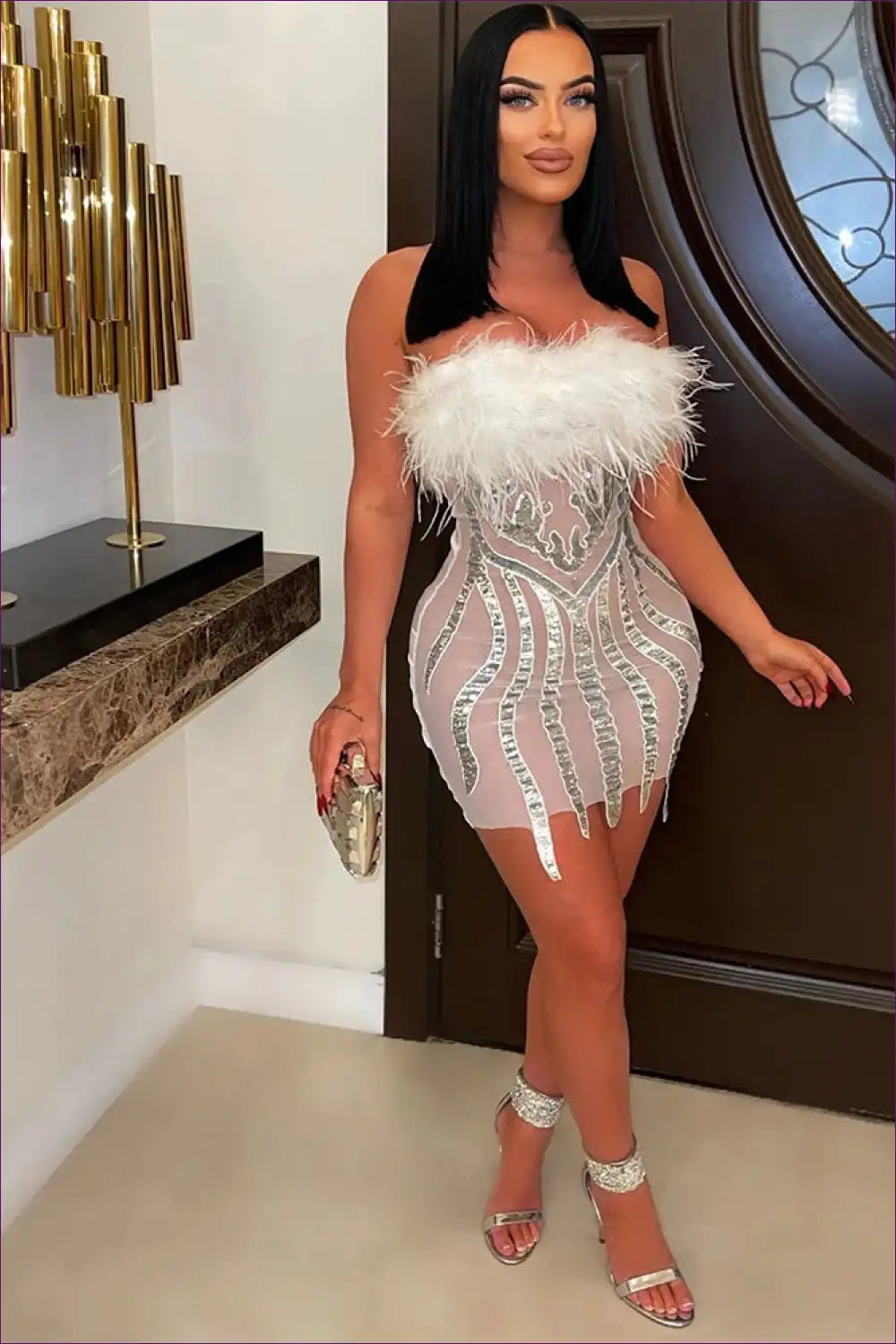 Ignite The Dance Floor In This Sexy Strapless Bodycon Featuring Captivating Elegance Of Sequins & Feathers.