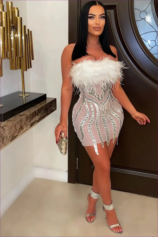 Ignite The Dance Floor In This Sexy Strapless Bodycon Featuring Captivating Elegance Of Sequins & Feathers.