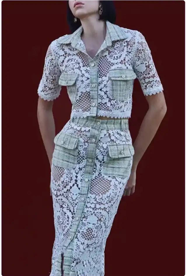 Fitted lace dress with utility pockets and a collared neckline.