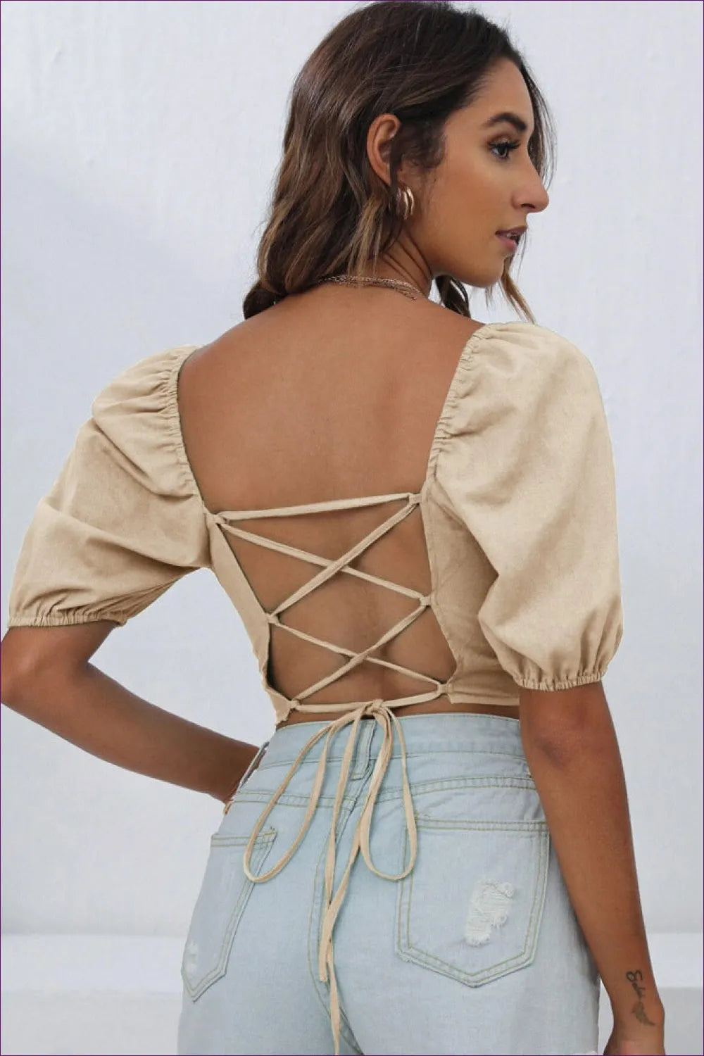 Make a Statement With Our Backless Lace Up Short Sleeve Top. Lightweight And Comfortable, It Features