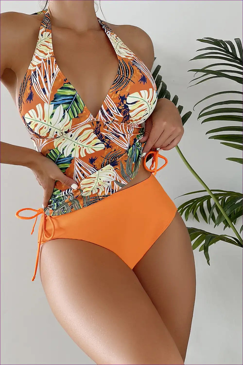 Embrace The Boho Spirit With Our Stunning Tropical Lace-up Bikini. Featuring a Captivating Leaf Print