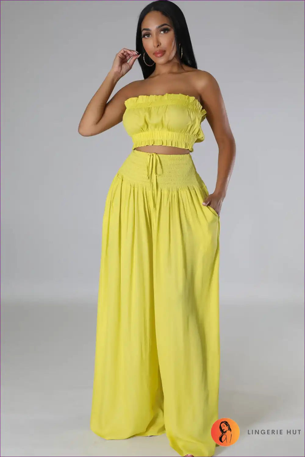 Capture Summer Elegance With Our Elegant Strapless Crop Top And High Rise Ruffle Pants Set. Exude Grace