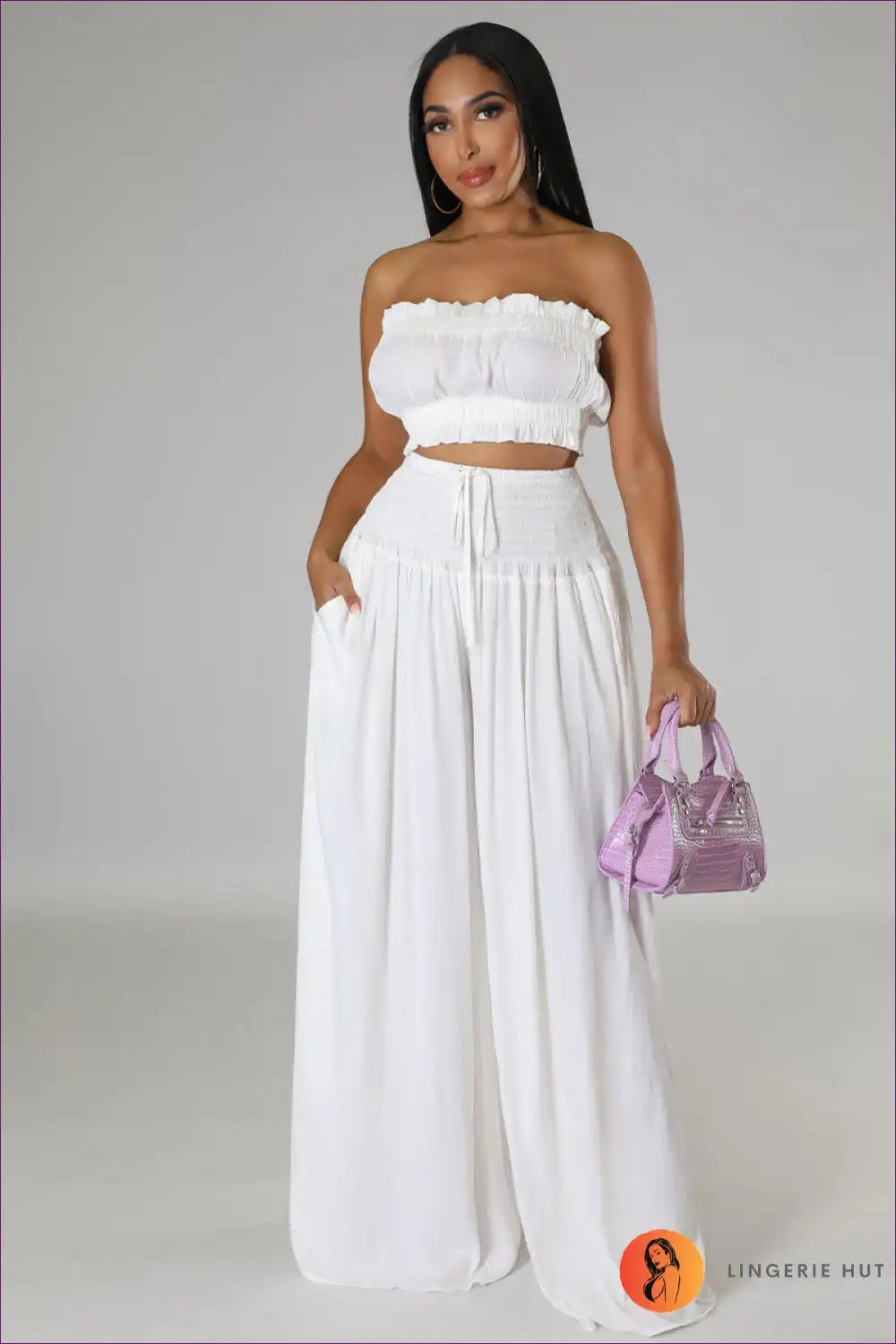 Capture Summer Elegance With Our Elegant Strapless Crop Top And High Rise Ruffle Pants Set. Exude Grace