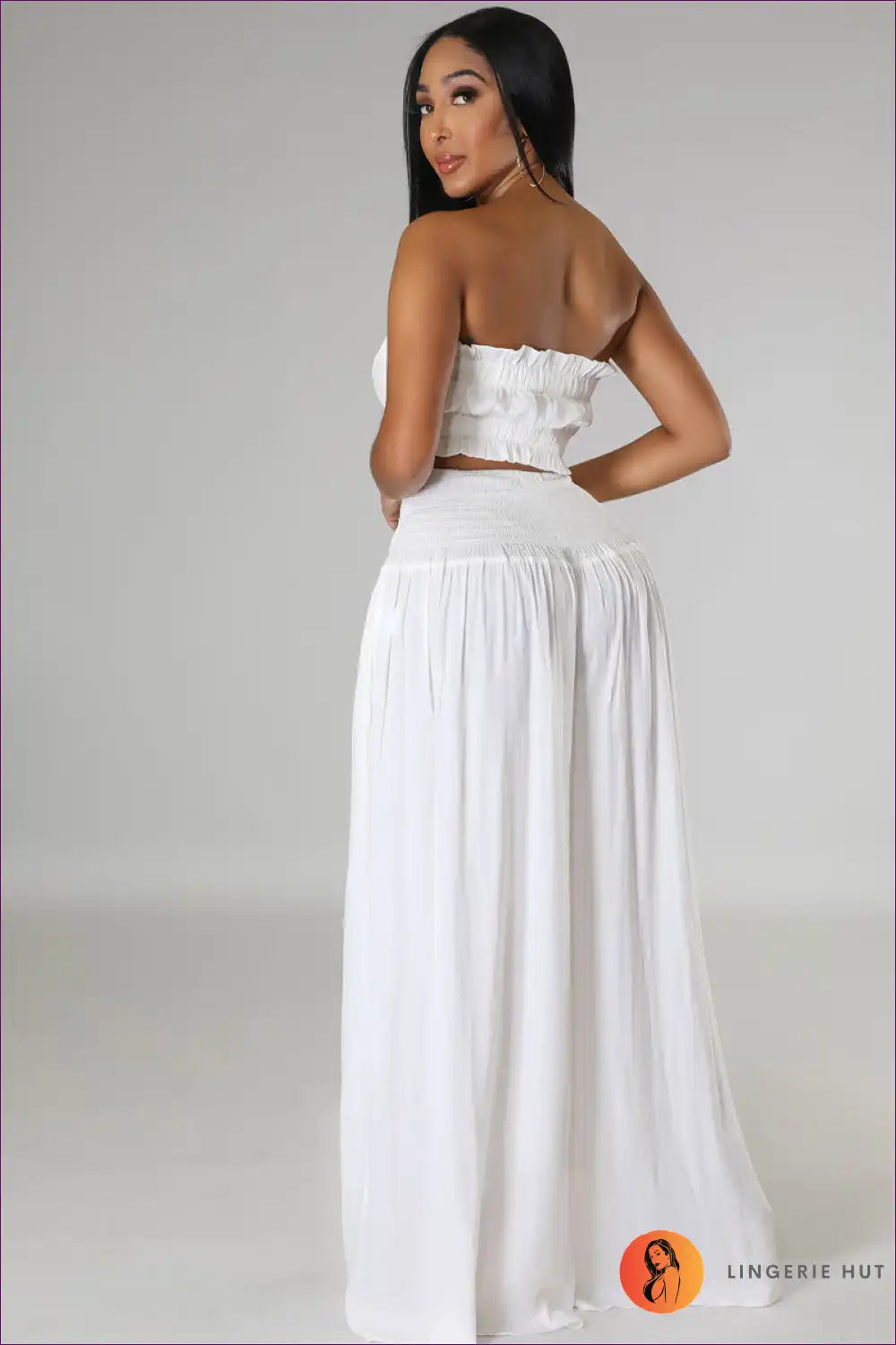 Capture Summer Elegance With Our Elegant Strapless Crop Top And High Rise Ruffle Pants Set. Exude Grace