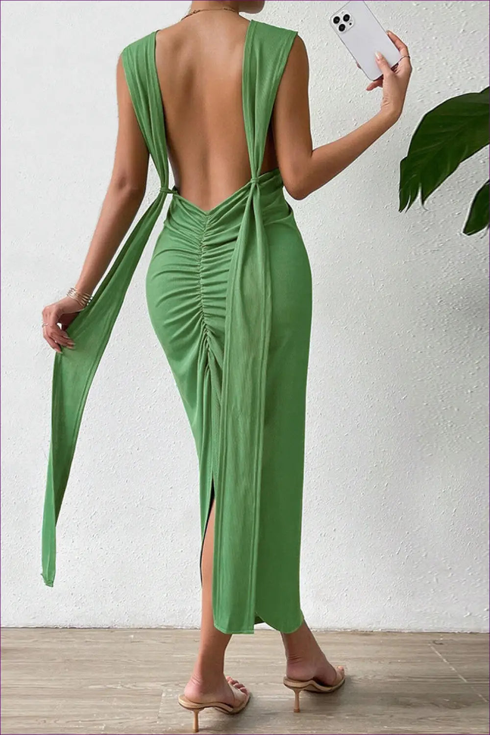 Make a Glamorous Statement In Our Elegant V-neck Maxi Dress. The Alluring Backless Tie Design And Slim Fit