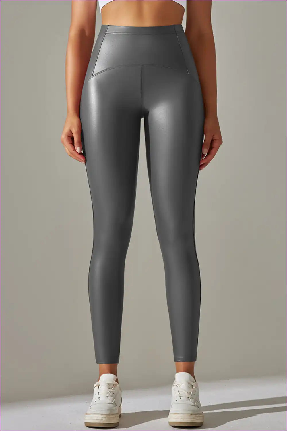 Elevate Your Active Lifestyle With Our Faux Leather Leggings. Featuring High Elasticity And a Bright Black