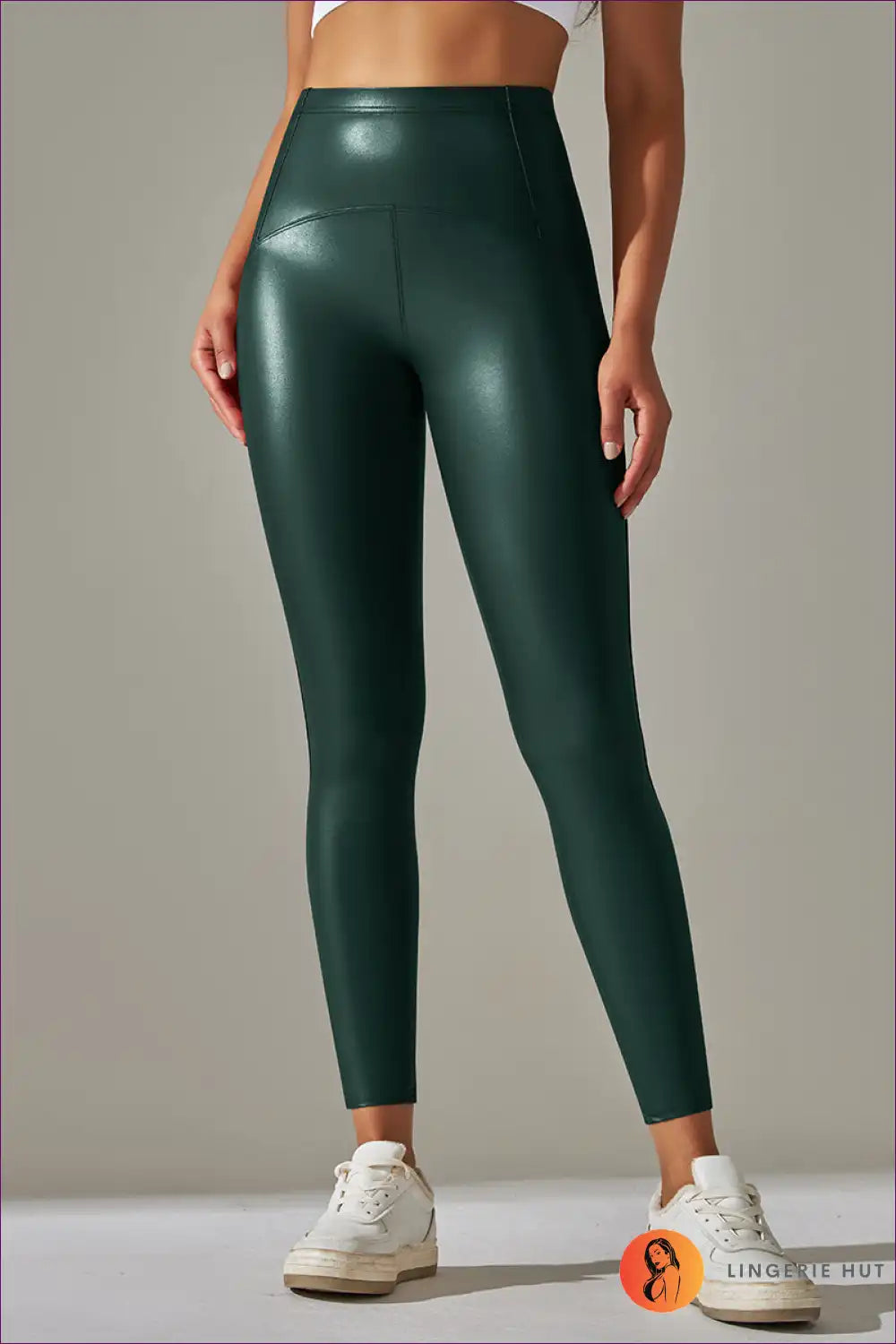 Elevate Your Active Lifestyle With Our Faux Leather Leggings. Featuring High Elasticity And a Bright Black