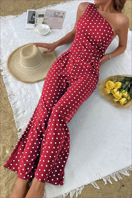 Embrace Chic Elegance With Lingerie Hut’s Polka Dot Bootcut One Shoulder Jumpsuit. Slim Fit Meets Unique