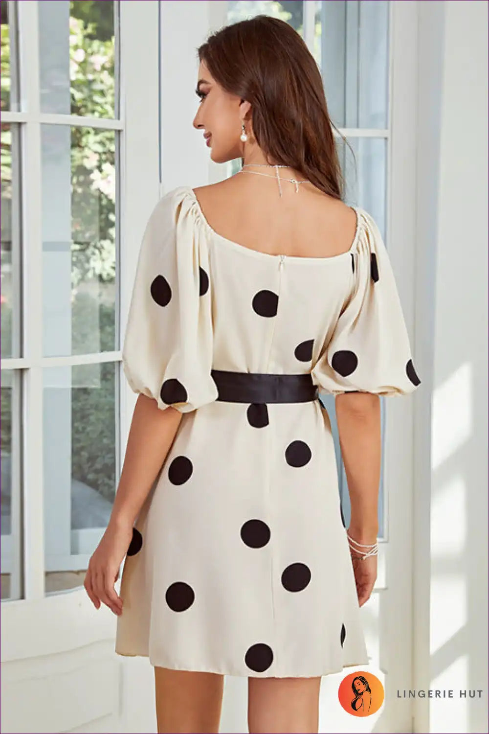 Elevate Your Style With Our Chic Polka Dot Puff Sleeve Dress. Timeless Elegance Meets Playful Charm For