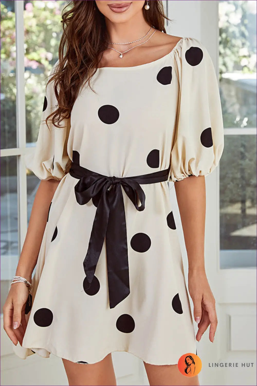 Elevate Your Style With Our Chic Polka Dot Puff Sleeve Dress. Timeless Elegance Meets Playful Charm For