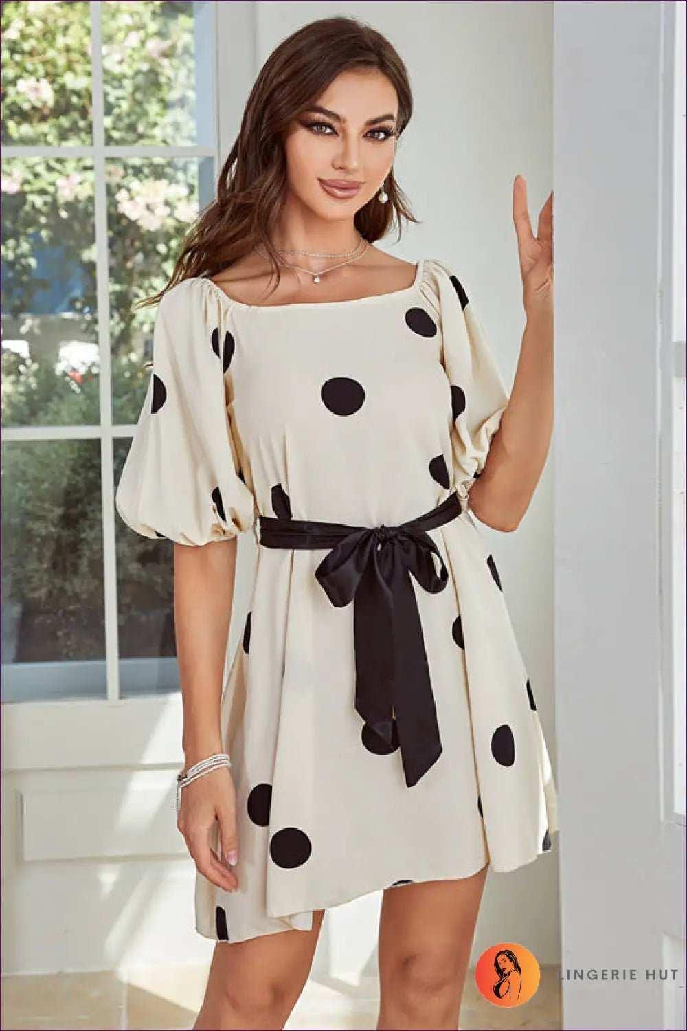 Elevate Your Style With Our Chic Polka Dot Puff Sleeve Dress. Timeless Elegance Meets Playful Charm For