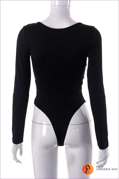 Make a Statement With Our Ring Detail Cut Out Long Sleeve Thong Bodysuit. Crafted From Sheer Fabric, Featuring