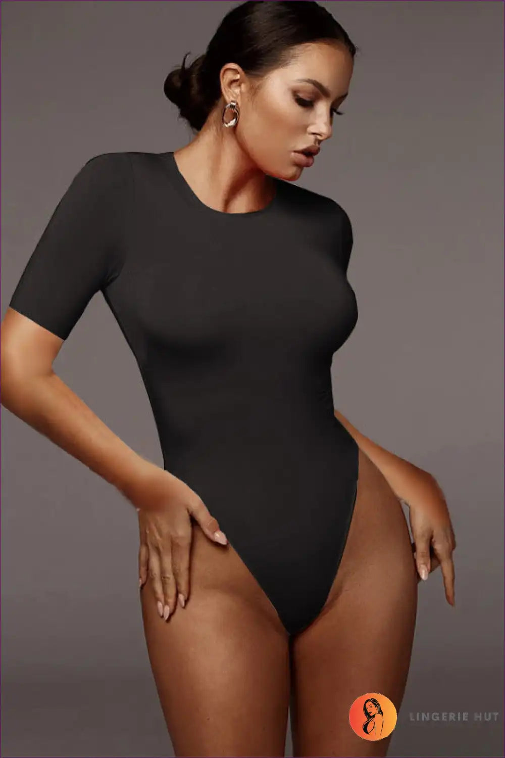 Discover The Perfect Blend Of Comfort And Style In Our Round Neck Short Sleeve Thong Bodysuit. Deep V-neck,