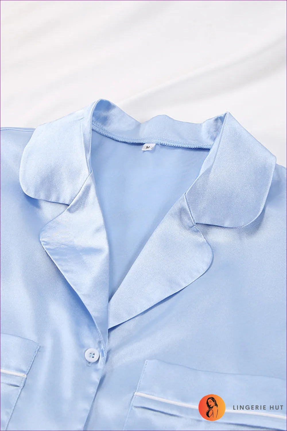 Experience The Perfect Blend Of Comfort And Elegance With Our Satin Button Up Feather Trim Pyjama Set. Crafted
