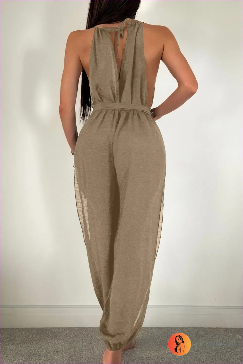 Elevate Your Beach Style With Our Sleeveless Tie-waist Jumpsuit Cover-up. Cool, Chic, And Sun-protective, It’s