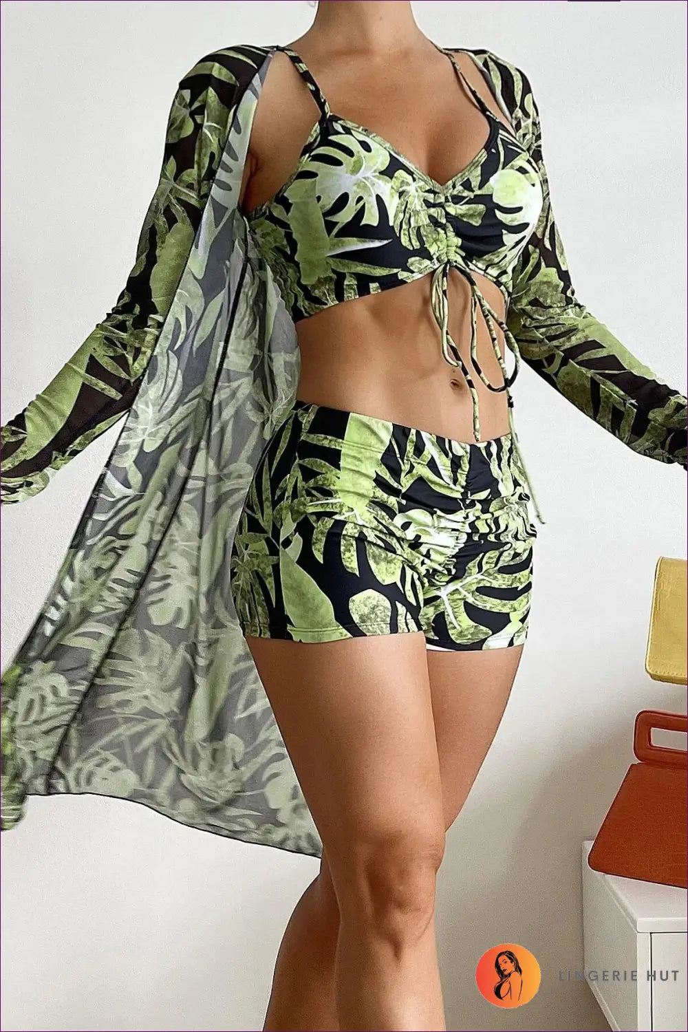 Make a Statement At The Beach With Our Stylish Three-piece Swimsuit Featuring High Waist And Long Sleeves.