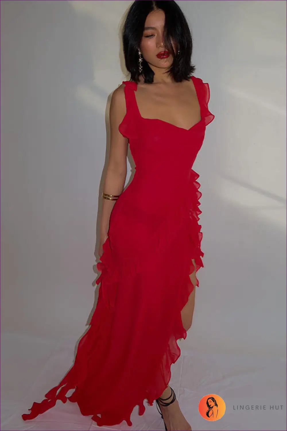 Unleash Your Allure With Our Sultry Split Maxi Dress! Turn Heads At Parties & Clubs This Flirtatious Ruffle