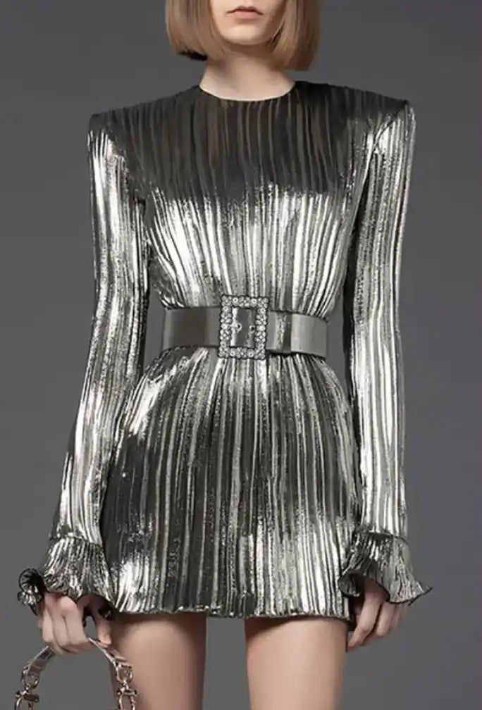 Metallic silver pleated mini dress with long sleeves and a wide belt at the waist.